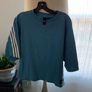 Adidas blue top. Blue with signature lines. Light weight and soft. NWOT
